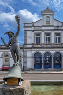 Sculpture Den Bonmo in front of railway station in the city Ronse, Renaix, oldest train station of