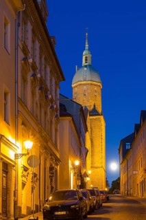Große Kirchgasse to St Annen Church at dusk and full moon, Annaberg-Buchholz, Erzgebirge, Saxony,