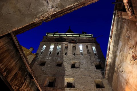 Romania, hour tower at the blue hour in the historic old town of Sighisoara, German Sighisoara,