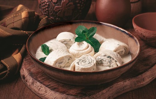 Gebjalia, a traditional Georgian dish, cold appetizer of cheese with mint, Megrelian cuisine, on a