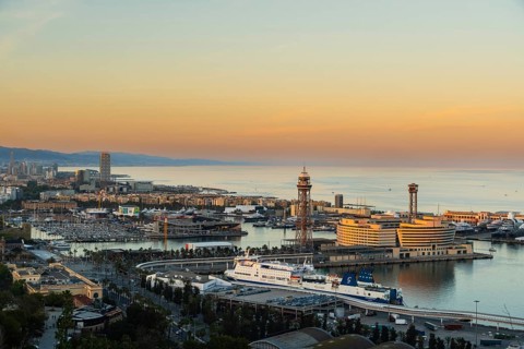 View of the old harbour and the city of Barcelona in the evening light, Spain
