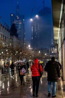 Rainy weather, freezing rain, pedestrian zone Zeil, shopping street, high-rise skyline in clouds,