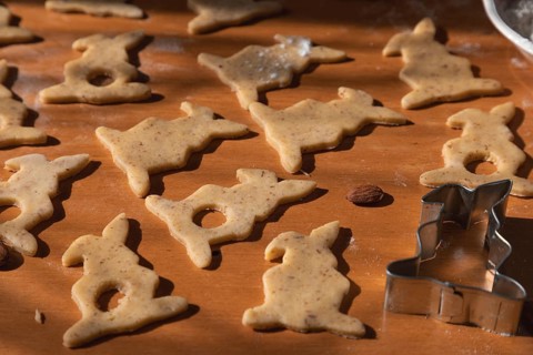Cut out bunny cookies and a cookie cutter for Easter