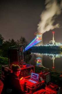 Protest action broadcast by the anti-nuclear organization, projection, night view, 05-03-2026,
