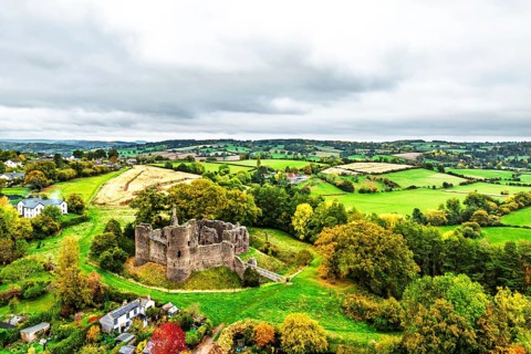 Autumn Colours over ruins of Grosmont Castle from a drone, Grosmont, Monmouthshire, Wales, UK