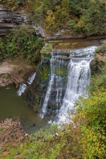 Swimmers and paddleboarder at the base of Burgess Falls along the River Trail, Falling Water River,