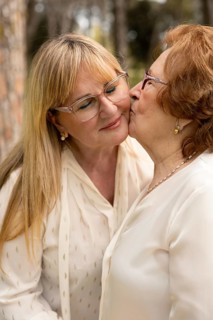 A heartwarming moment between a mother and daughter, illustrating the bond and affection they