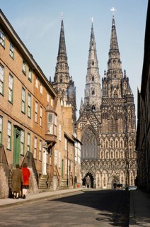 People walking in The Close towards Lichfield Cathedral Church, Lichfield, Staffordshire, England,