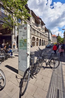 Stele with location sign, pedestrian zone, general architecture, residential buildings and