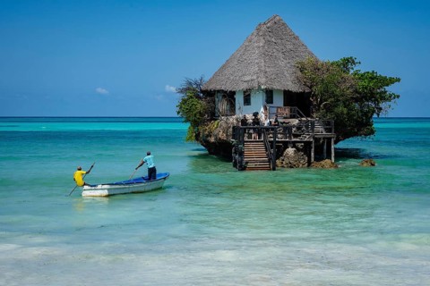 MICHAMVI PINGWE, ZANZIBAR - OCTOBER 19, 2025: the famous Rock Restaurant in Zanzibar at high tide,