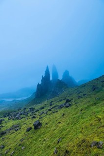 UK. Scotland. Isle of Skye. The Old Man of Storr covered in mist during a storm