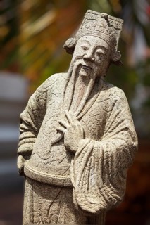 Chinese stone guardian statue in Wat Pho Buddhist Temple, Bangkok, Thailand