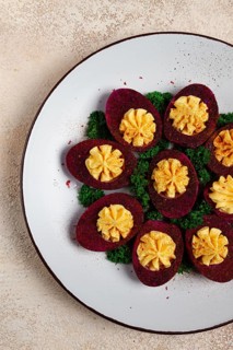Stuffed eggs, stained with beetroot juice, purple, pitaya powder, top view, top view, close-up, no