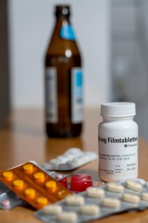 Symbolic image, taking medication and alcohol, should not be done, alcohol and medicine are not