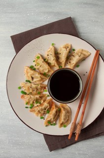 Japanese Gyoza dumplings, fried, with sauce, top view, without people, tinted, selective focus