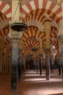 Cathedral Mosque of Cordoba (Mezquita-Catedral), architecture with repeated arches and chain lamps