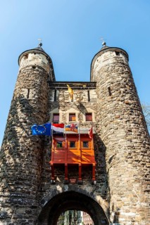 Maastricht, Netherlands, The Helport, A medieval city gate with towers, decorated with flags,
