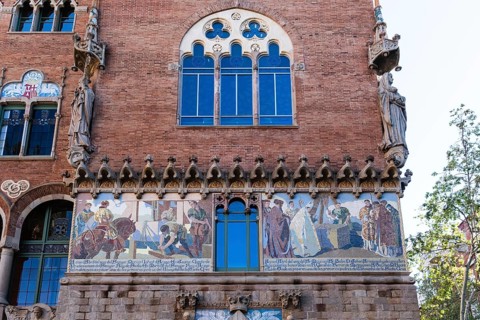 Detail with mosaics on a façade of the Hospital Santa Creu i Sant Pau in Barcelona, Spain