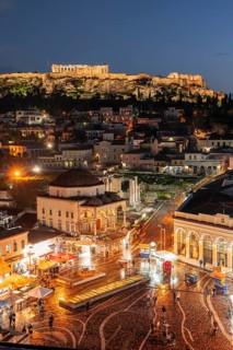 View over the old town of Athens, Tzisdarakis Mosque and Acropolis, illuminated Monastiraki Square,