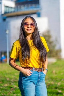 Vertical portrait of a beauty cool chinese exchange student in the campus