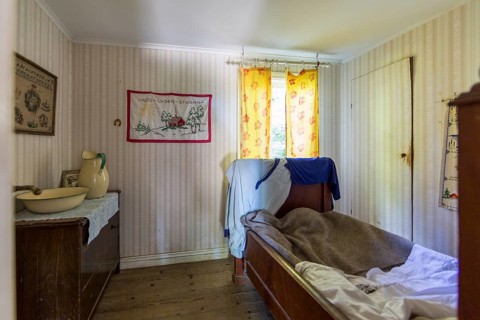 Bed in the bedroom in the replica house of Petterson and Findus based on a children's book by Sven