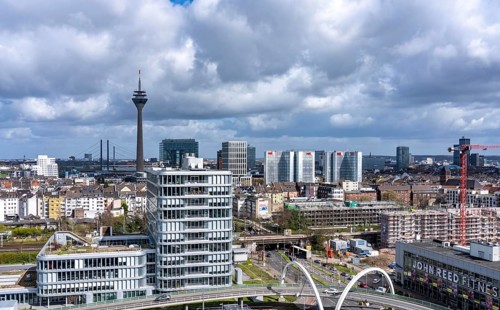 Skyline of buildings in downtown Düsseldorf, Rheinturm, Rheinbrücken, road bridge on Völklinger