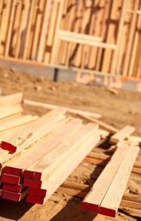 Stack of Building Lumber at Construction Site with Narrow Depth of Field