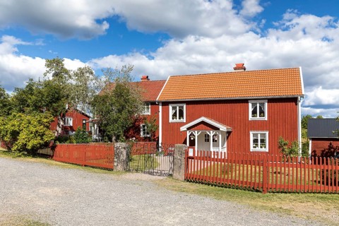 3 typical Swedish red houses, these houses in Sevedstorp are the basis for a children's book by