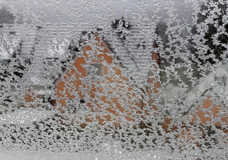 Ice on a window pane with indistinct view of a house in winter, Witten, North Rhine-Westphalia,