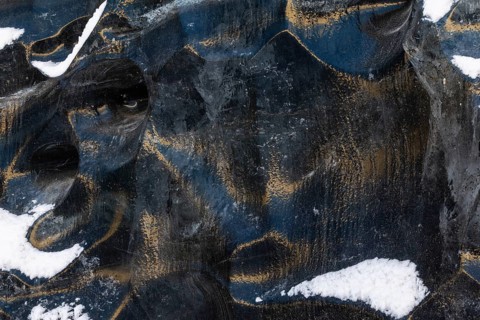 Structures in glacial ice, ice cave, glaciers, black glaciers reflecting sunlight, snow,
