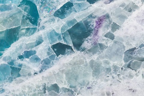 Detailed macro image of a fluorite, calcium fluoride, slab from China, featuring translucent layers
