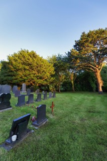 Gravestones in a meadow, Cemetery, All Saints Church, Llangorwen, Aberystwyth, Ceredigion, Wales,