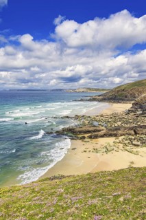 Awesome view at a rocky coastline with a flowering meadow and sandy beaches a beautiful sunny