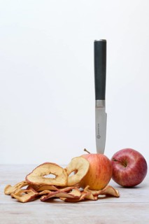 Apple with knife and apple rings, dried fruit