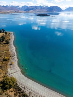 Aerial view of Lake Tekapo in Canterbury, New Zealand, showcasing a breathtaking turquoise lake
