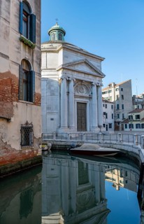 Church Chiesa di Santa Maria Maddalena, reflected in the canal, Cannaregio, Venice, Veneto, Italy