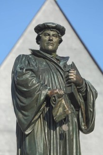 Monument to Martin Luther with Bible, bronze sculpture, market square, Luther city Eisleben, Harz