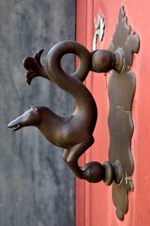 Braunschweig horse door knocker in the city centre on the front door of a half-timbered house,