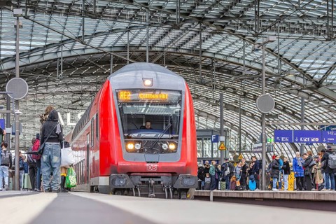 Berlin Central Station. Travelers on the platform. Incoming train. RegionalExpress RE2 to Cottbus.