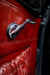 Front door with window crank and red leather trim, vintage car, Volvo Amazon, medium class car from