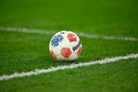 Adidas Derbystar game ball is on grass soccer Bundesliga, Allianz Arena, Munich, Bayern, Germany