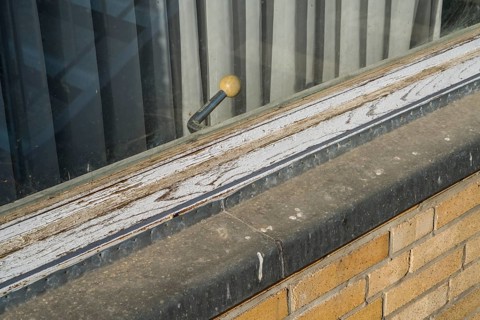 Old building, casement window with a rotary handle