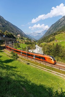 Railway passenger train of the type Stadler Flirt of the Südostbahn on the Gotthard railway in the