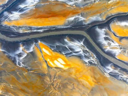From above, this image captures intricate abstract nature textures. The flowing patterns and