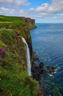 Impressive coastal landscape with waterfall and steep ocean cliffs, Kilt Rock Waterfall, Portree,