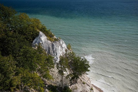 White chalk cliffs at Hundevængsfald with milky water from chalk sediment by the stormy Baltic Sea