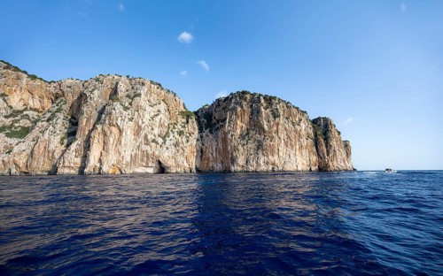 Picturesque rocky coast, cliffs and blue sea, Golfo di Orosei, Baunei, Sardinia, Italy
