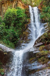 Waterfall in the rainforest with water crashing against rocks in Minas Gerais, Brazil, Minas