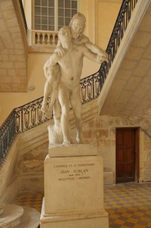 Stone sculpture of the blind and the lame by Jean Turcan, symbol, blind, lame, sick, helping,