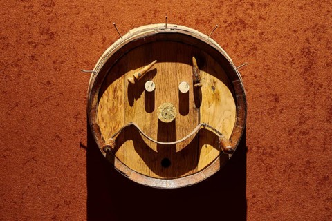 Creative wooden barrel wall art showing a friendly face, Achaia Clauss Winery, Patras, Peloponnese,